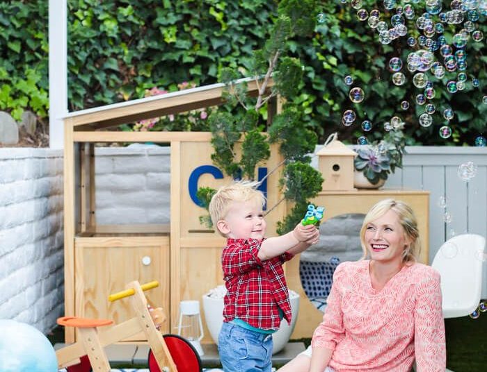 kid playing with bubbles