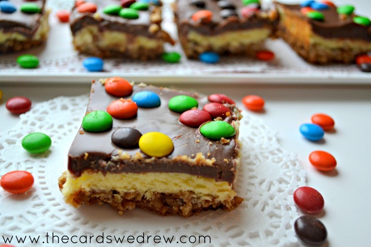 M&M Cheesecake bars w pretzel crust and chocolate icing